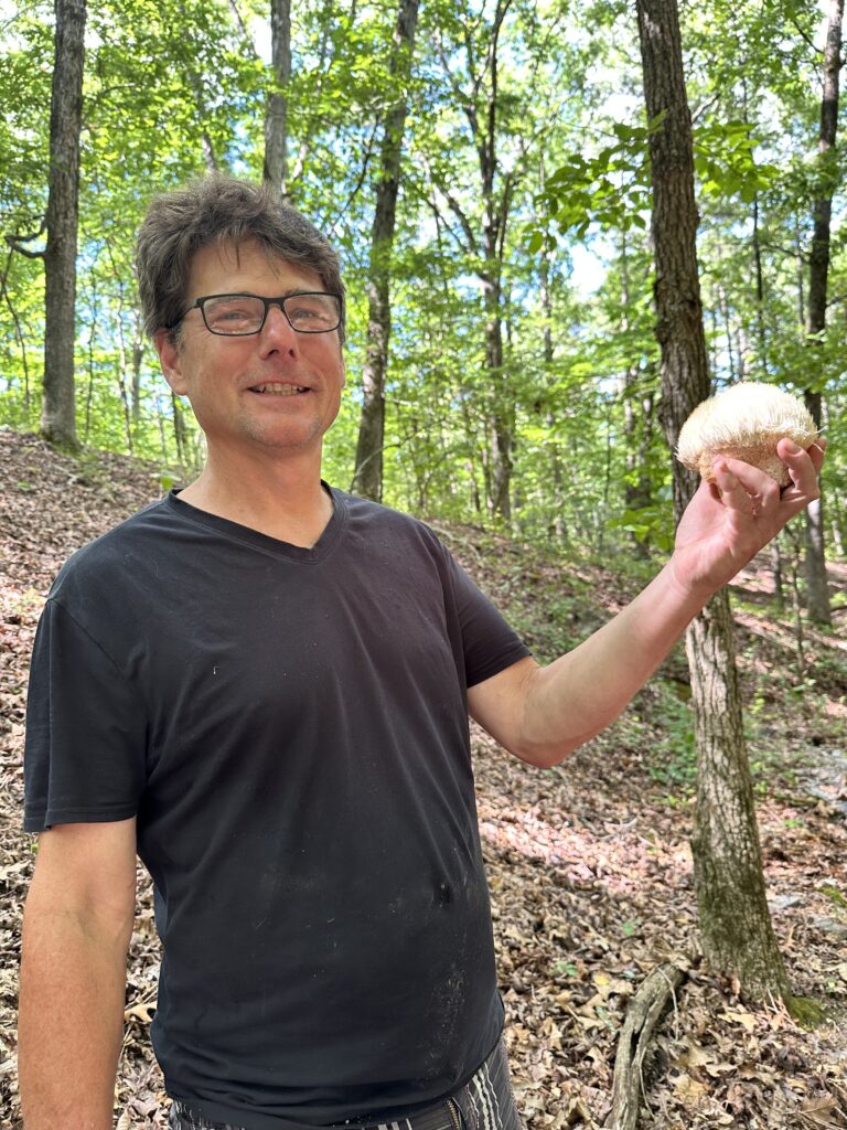 man holding a mushroom